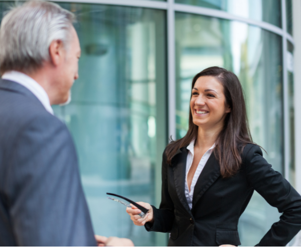 career coach prepping smiling woman for an interview