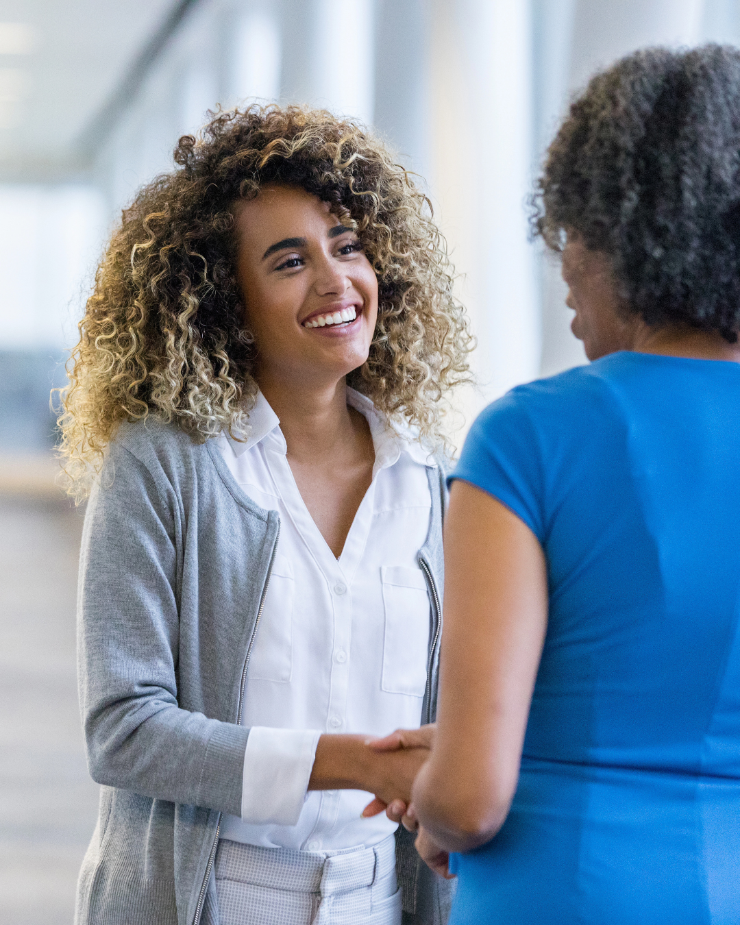 career coach shaking hands client career coach shaking hands with new client