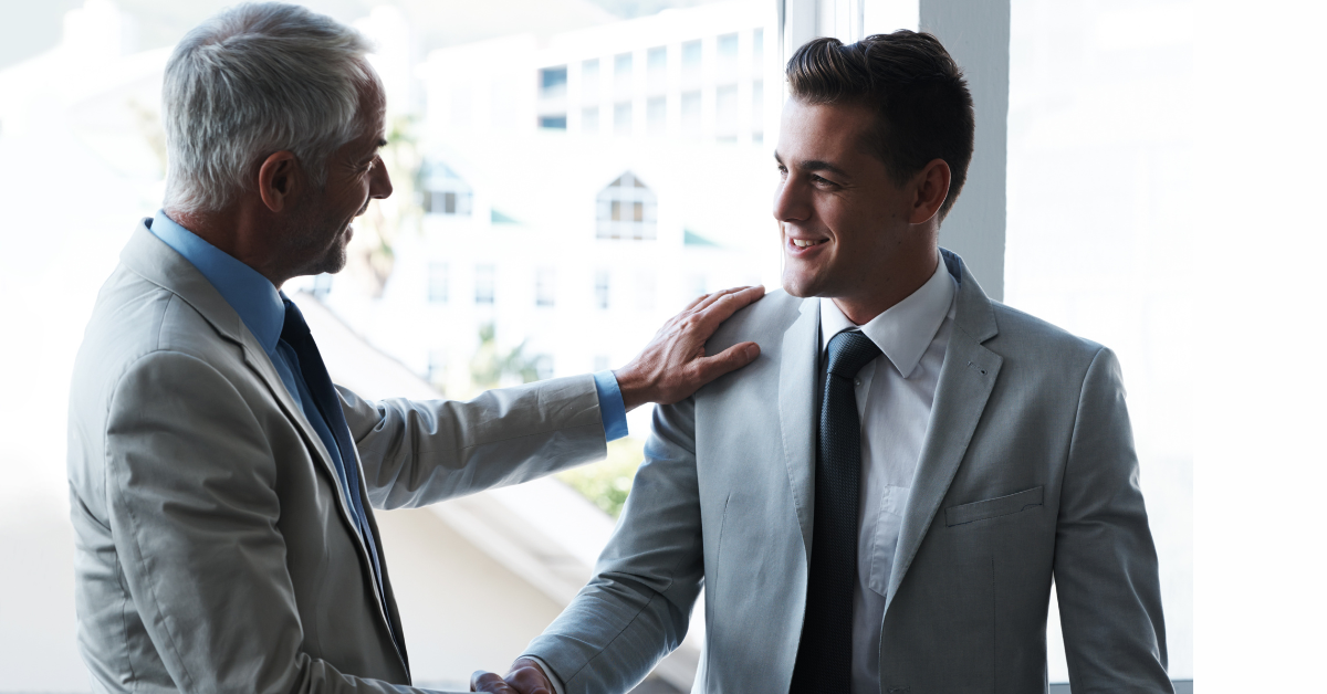 executive coach shaking hands executive executive coach shaking hands with executive client