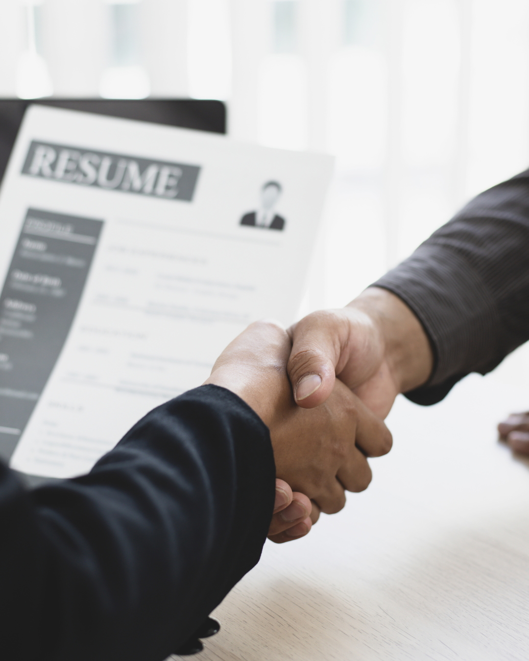 job interview shaking hands holding resume job interview shaking hands holding resume