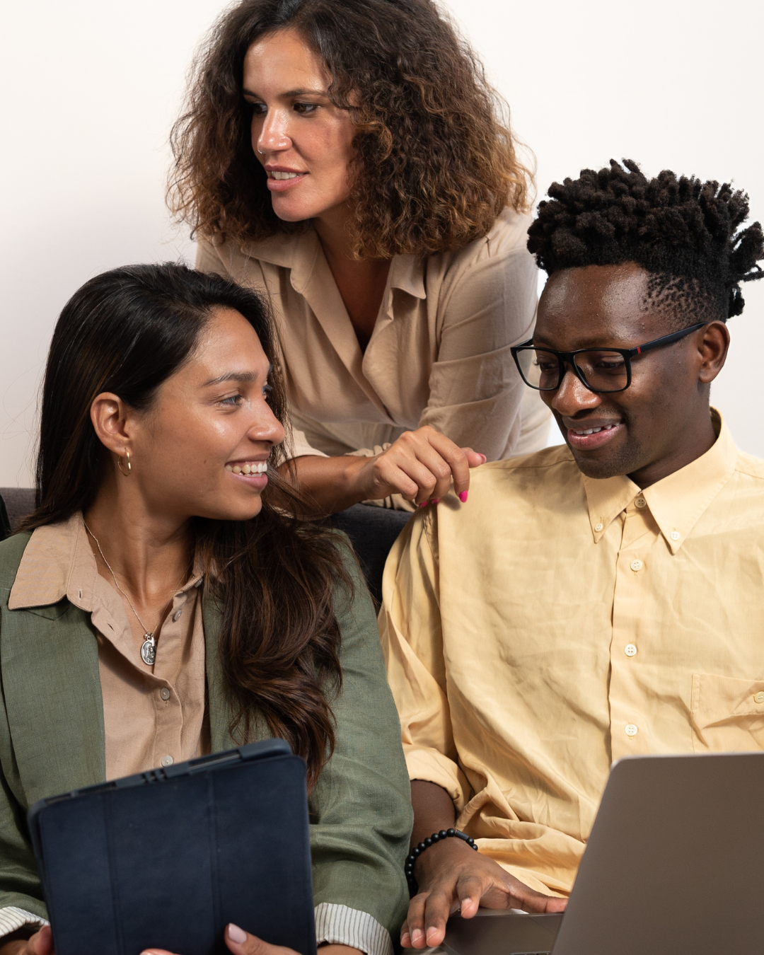professionals working together computer tablet professionals confidently working together after senior-level career coaching professional development