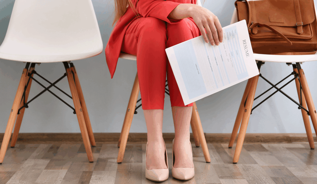 woman waiting for interview with resume in hand