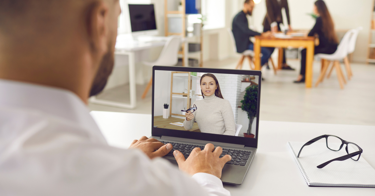 executive coach and client in a video call coaching session from remote offices