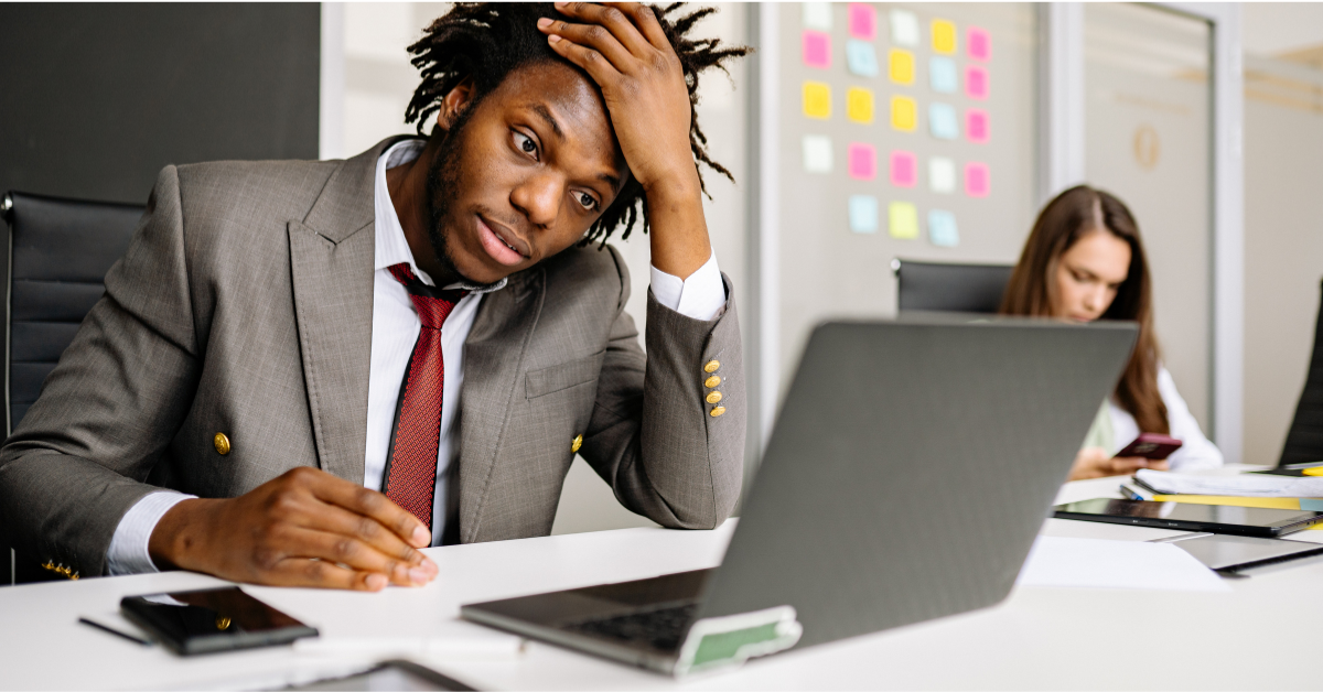 overwhelmed-executive-looking-at-computer
