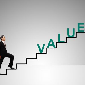 man walking up drawn stairs with the word value in green