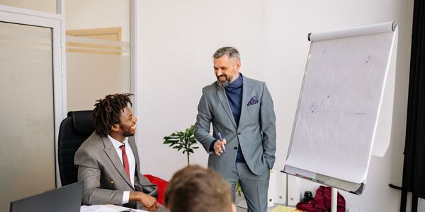 male executive coaching his team